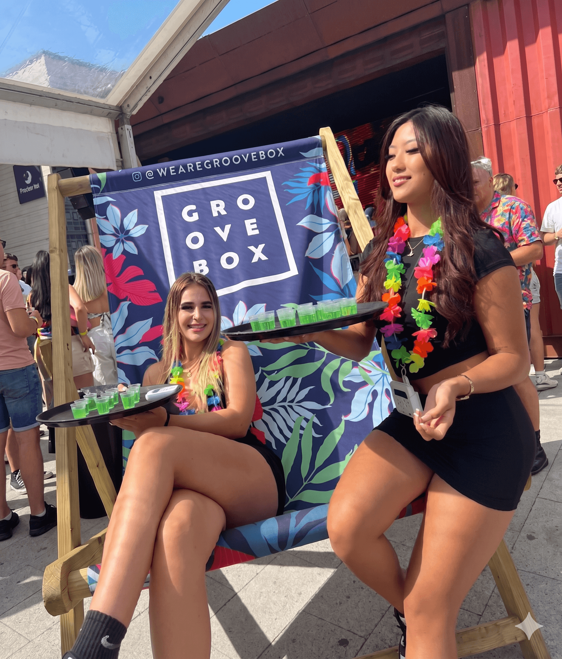 Brand ambassadors running a branded sampling stand at an outdoor activation