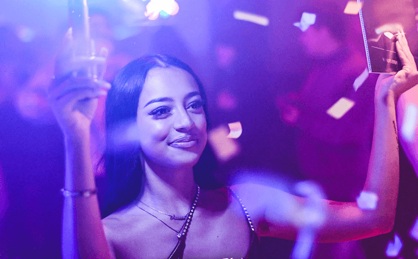 Guest buying shots on the floor of a nightclub